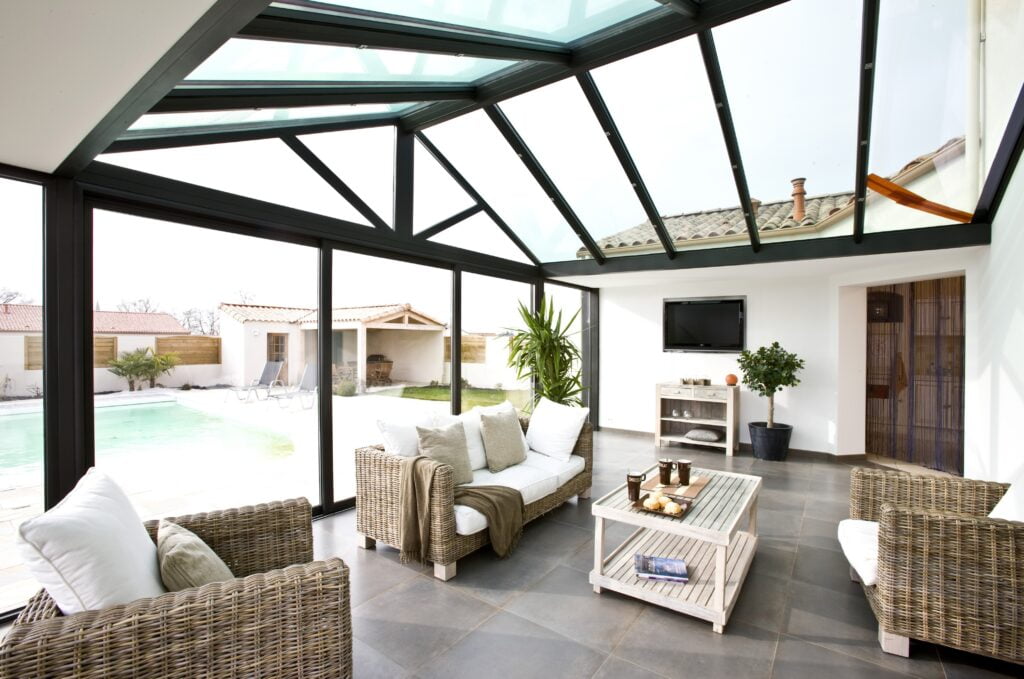 photo d'un extension de maison en verre de la marque Concept Alu