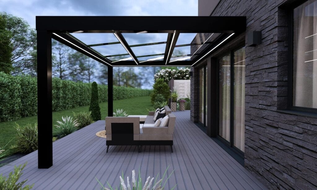 Intérieur extension Concept Alu Extanxia aménagée en bureau et salle de sport avec puits de lumière zénithal et vue panoramique sur jardin